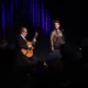 Martin Taylor playing a guitar and Alison Burns singing at the Port Erin Jazz Festival.